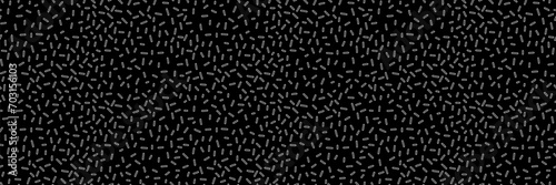 Small dash monochrome seamless pattern. Scattered organic line element on black background. Vector illustration for textile, wallpaper, decor. 