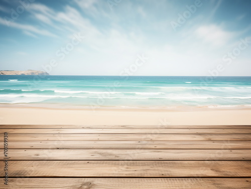 Wooden table by the beach with blurred ocean and sky background