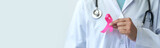 Breast cancer campaign Illustration of woman's hand in doctor's uniform and pink ribbon showing battle To save lives and illnesses World cancer day concept, insurance, copy space, banner, panorama.