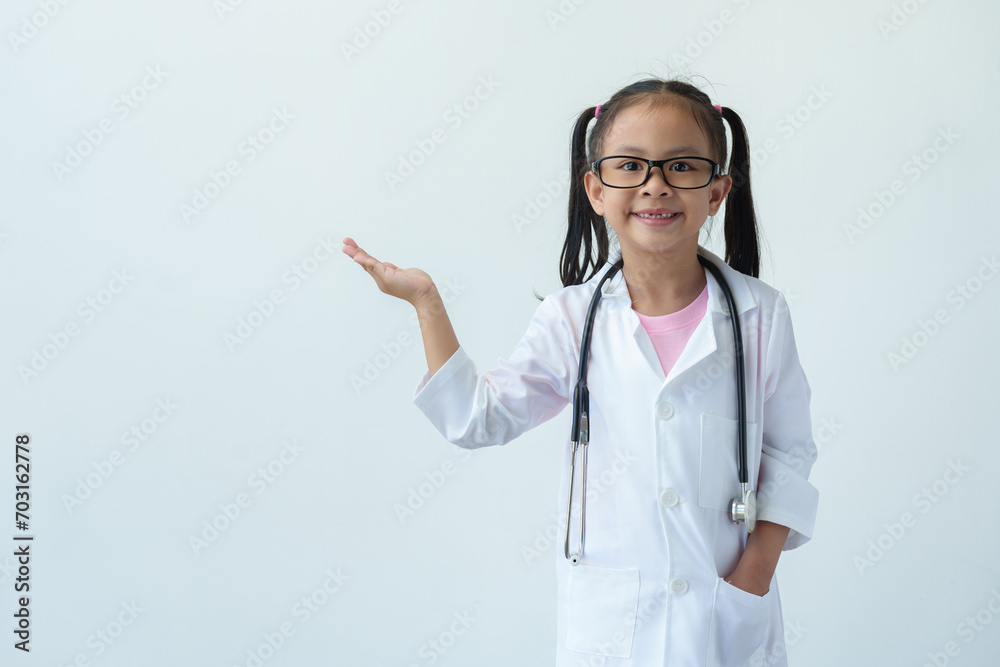 A young girl wearing a doctor's uniform and wearing glasses stands smiling and holds glasses playing doctor, showing various gestures, emotions, and imaginative thinking on a white background. A young girl wearing a doctor's uniform and wearing glasses stands smiling and holds glasses playing doctor, showing various gestures, emotions, and imaginative thinking on a white background.