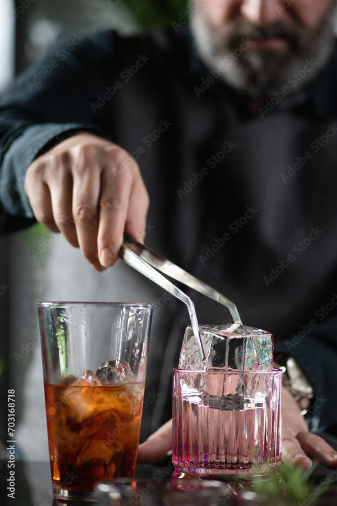 Barman Adds Giant Ice Cube to Negroni Cocktail Barman Adds Giant Ice Cube to Negroni Cocktail