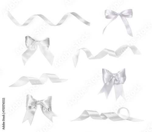 White satin ribbons and bows isolated on white  set