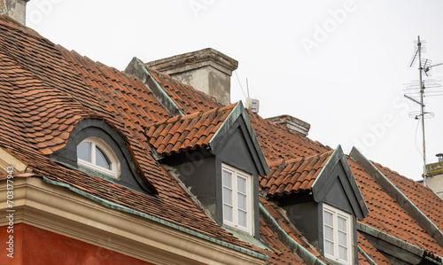 Terracotta Tiled Roofs with Dormer Windows in Poznań, Poland © Algimantas