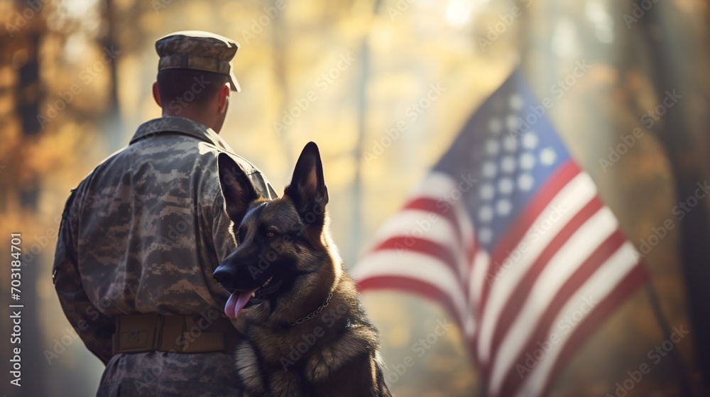 Overview of a wide scene displaying the poignant image of a military man's back with a service German Shepherd, standing against the US flag on Veterans Day. - obrazy, fototapety, plakaty 