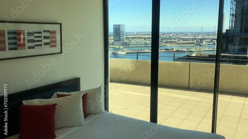 Bedroom with city and sea views. Docklands, Melbourne, Australia. photo