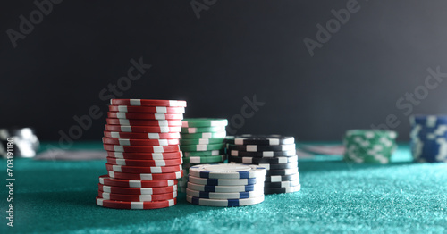 Detail of stacks of game chips on green felt