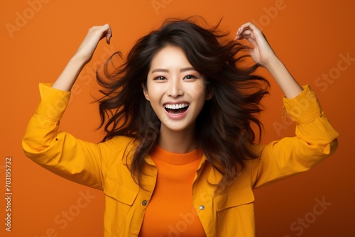 Portrait of a happy young Asian woman photo