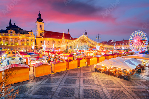 Sibiu, Romania. Christmas Market in Large Square, medieval downtown of Transylvania, famous European Xmas Fair.