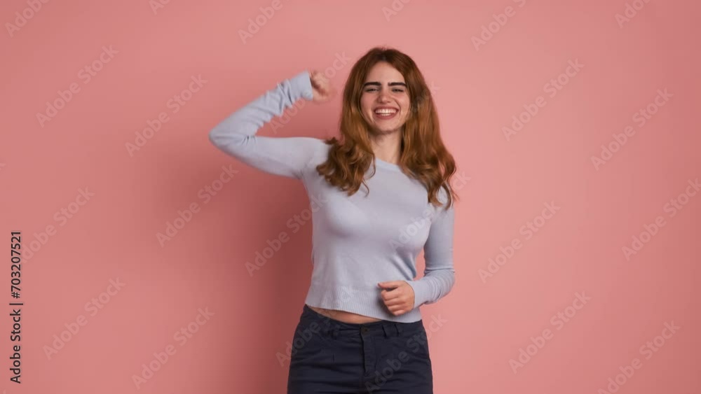 Young woman jumping as celebrating raising arms Young woman jumping as celebrating raising arms