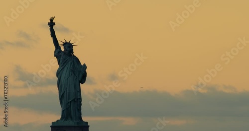 Statue of Liberty Framed Left with Orange Clouds