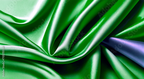Smooth, elegant, green silk or satin luxury fabric texture as an abstract background.