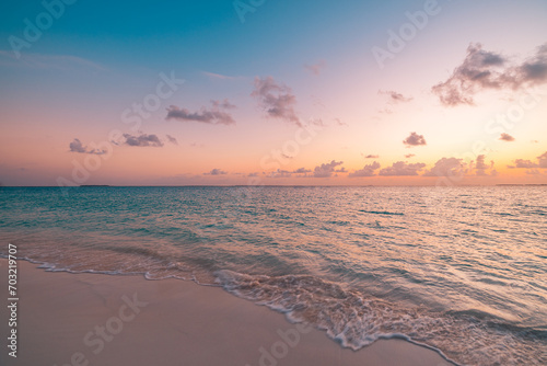 Sea sand sky concept, sunset colors clouds beachfront horizon. Inspire waves beams, meditation nature landscape, beautiful colors, wonderful scenery of tropical beach. Beachside travel summer vacation