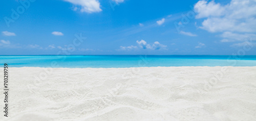 Closeup sandy beach, sunny blue sea sky. Panoramic beach landscape. Empty tropical beachfront and seascape copy space. White soft sand texture, calmness, tranquil relaxing sunlight, summer dream mood