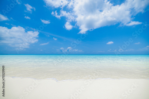 Closeup sandy beach, sunny blue sea sky. Panoramic beach landscape. Empty tropical beachfront and seascape copy space. White soft sand texture, calmness, tranquil relaxing sunlight, summer dream mood