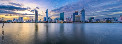 Panoramic image of Ho Chi Minh City viewed from the other side of the Sai Gon River on sunset in Ho Chi Minh City, Vietnam