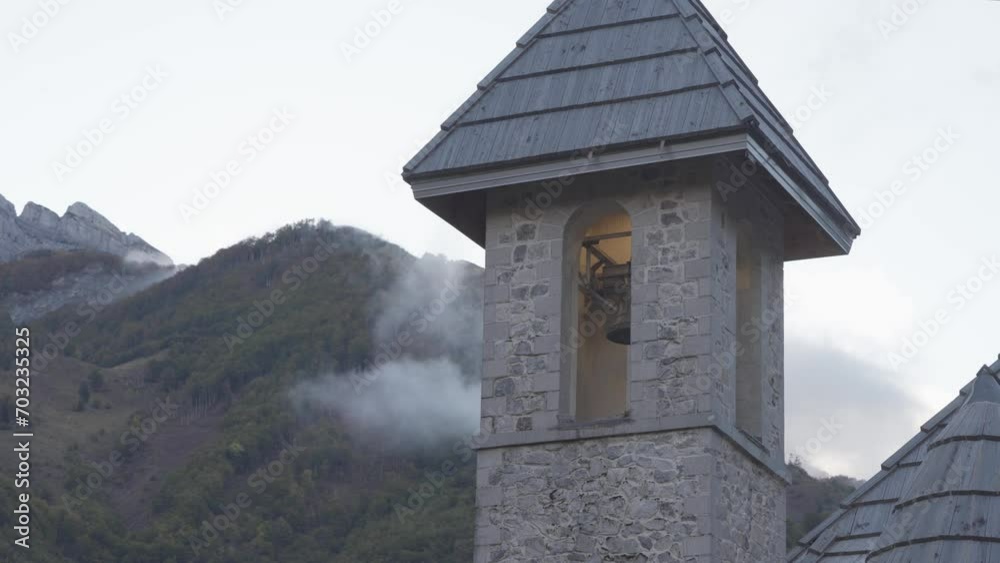 Shingle Roofed Bell Tower Of Catholic Church Of Theth In Shkoder, Albania. closeup, static shot Shingle Roofed Bell Tower Of Catholic Church Of Theth In Shkoder, Albania. closeup, static shot