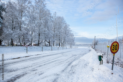 Winter road where the maximum speed is 30 kilometers per hour in Hassleholm, Sweden photo