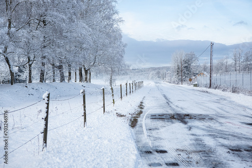 Road in winter landscape in Hassleholm, Sweden © StellaSalander