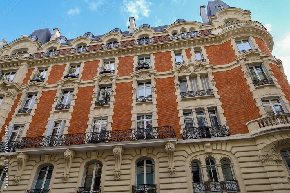 Fototapeta premium real estate , haussmannian architecture in Paris , red bricks facade