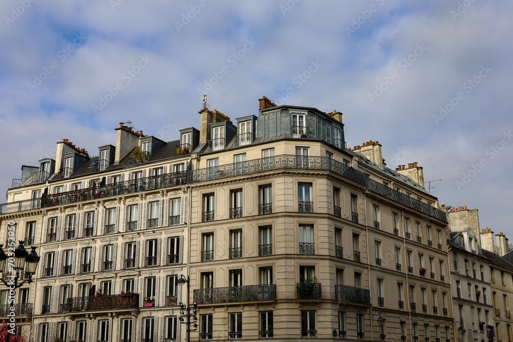 typical parisians building facade , haussmannian style , 2nd arrondissement