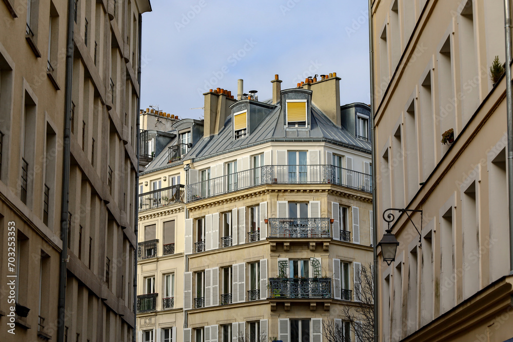 typical parisians building facade , haussmannian style  ,  1st arrondissement