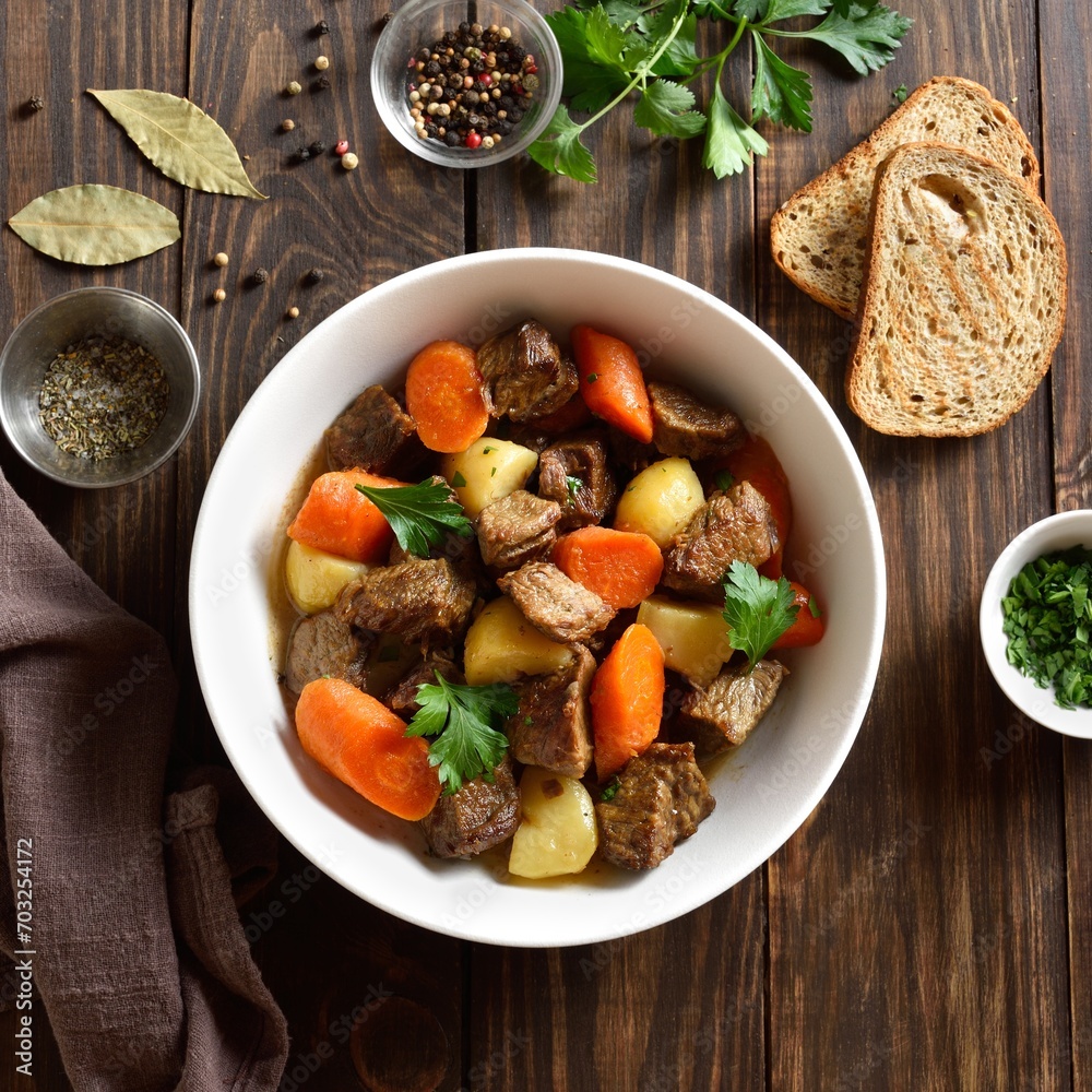 Beef meat stewed with potatoes, carrots and spices Beef meat stewed with potatoes, carrots and spices