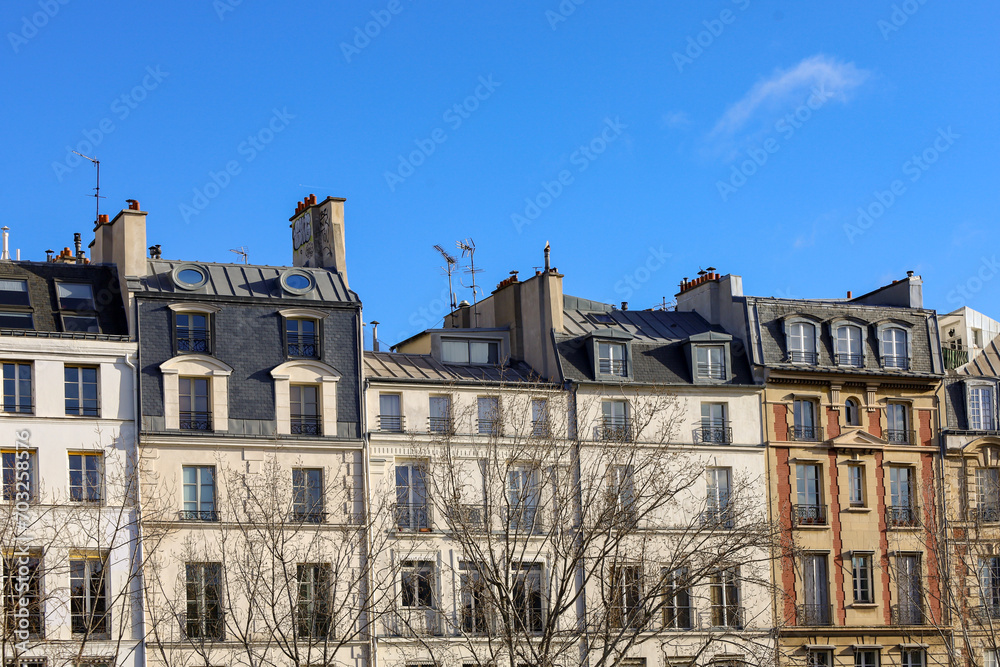 typical parisians building facade , haussmannian style  , Seine river embankments