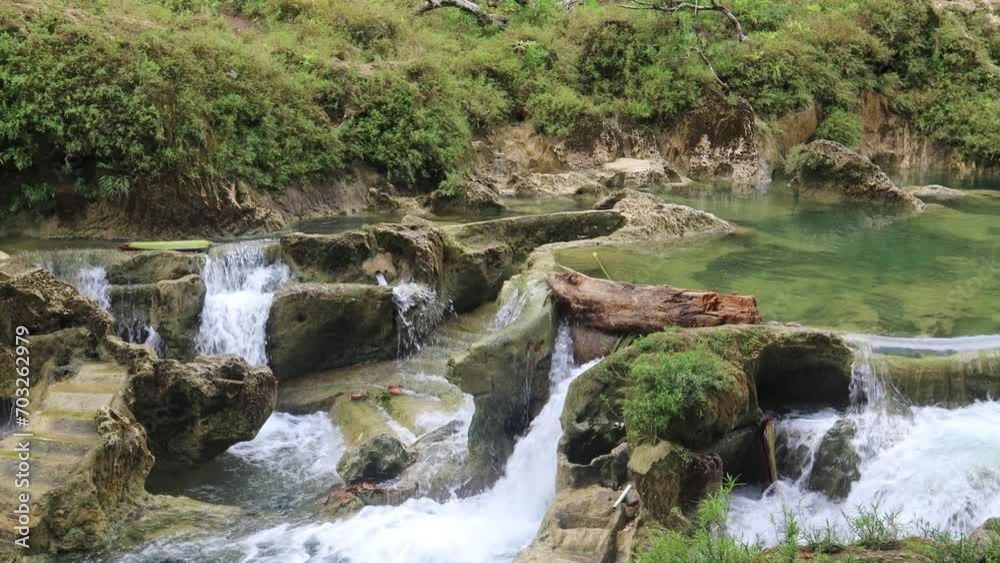 View of a beautiful waterfall in the forest, Tasikmalaya, West Java, Indonesia View of a beautiful waterfall in the forest, Tasikmalaya, West Java, Indonesia