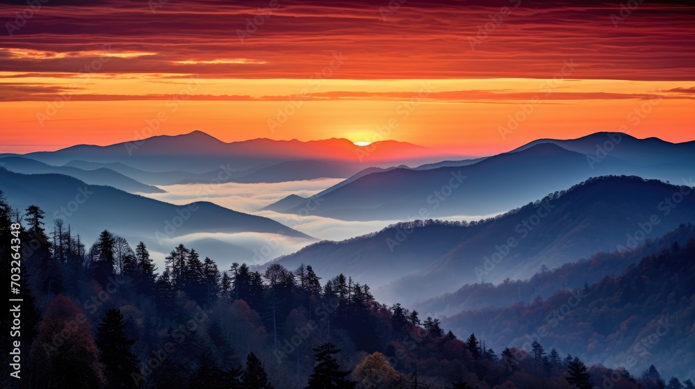 Mountain landscape with forested hills with fog in the valley at sunrise. Breathtaking natural scenery