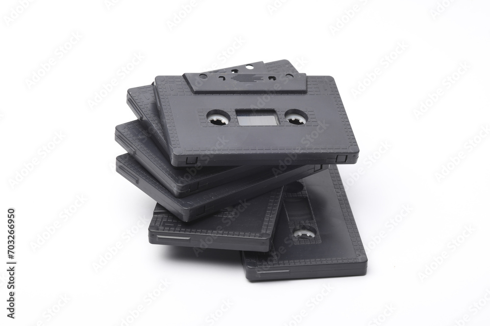 Stack of retro 80s audio cassettes on white background Stack of retro 80s audio cassettes on white background
