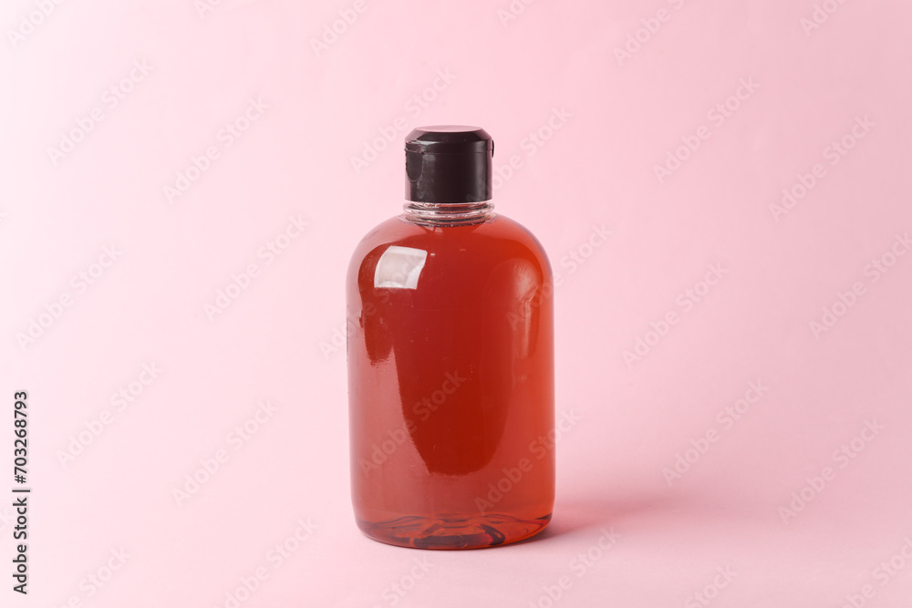 Bottle of liquid soap on a pink background Bottle of liquid soap on a pink background