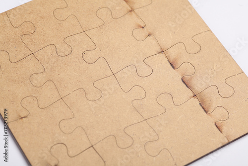 Wooden pieces jigsaw puzzle on white background