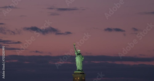 Center-framed Statue of Liberty with Pink Sky After Sunset