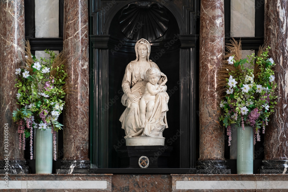 Obraz premium The Madonna of Bruges is a marble sculpture by Michelangelo of the Virgin Mary and Child, Church of Our Lady, Bruges, Belgium.