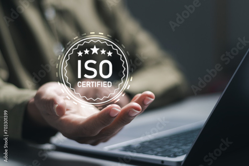 ISO standards quality control. Businessman use laptop with quality assurance with five stars or guarantee product. ISO Standard certification. Modern ISO banner.