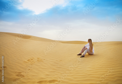 Beauty blond woman in desert. Sahara desert
