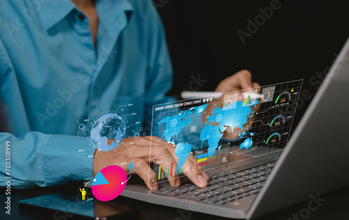 young businessperson using big data analysis and cloud technology to collect customer data and display on application dashboard from digital tablet to understand sale forecast and marketing plan..