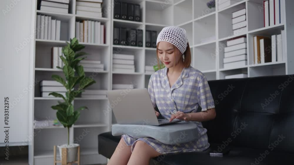 short hair woman is typing for chatting with friends and shopping online on laptop with happy face. short hair woman is typing for chatting with friends and shopping online on laptop with happy face.