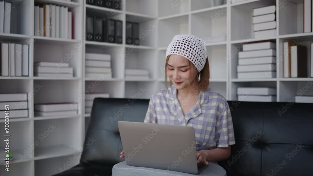 short hair woman is typing for chatting with friends and shopping online on laptop with happy face. short hair woman is typing for chatting with friends and shopping online on laptop with happy face.