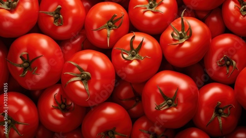  a pile of red tomatoes with a lot of green stems on the top of the tomatoes in the middle of the picture.