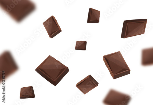 Falling chocolate pieces isolated on transparent background png © Nofi