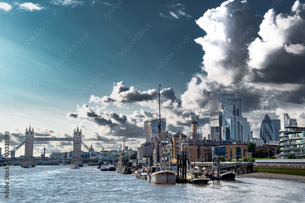 Tower Bridge And River Thames With Ships And Boats In Front Of Modern Office Buildings In The City Of London, United Kingdom