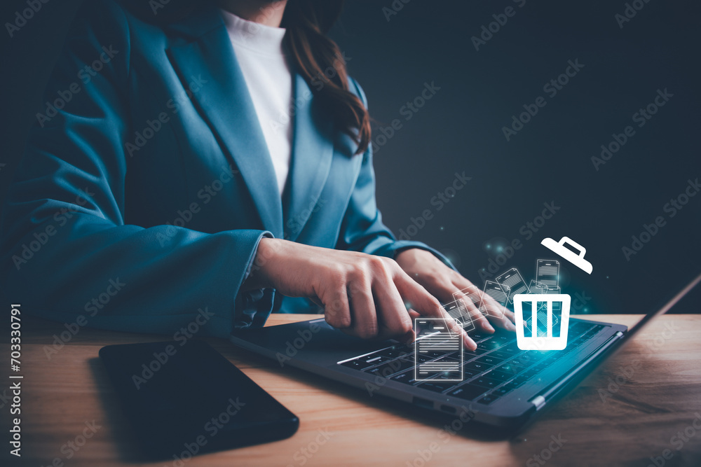 Φωτογραφία Businesswoman using computer laptop or smartphone delete files  from a computer or from the Internet