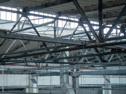 Interior of modern industrial building, detail of roof structure © Dmitry