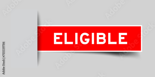 Red color square label sticker with word eligible that inserted in gray background
