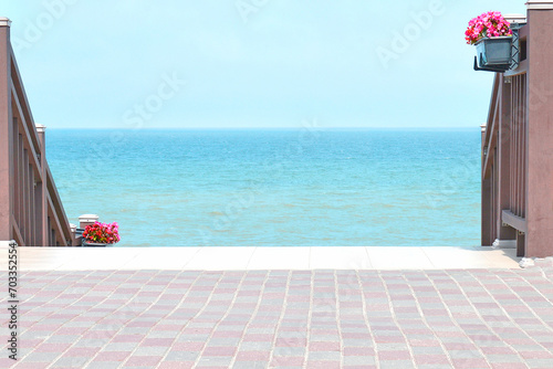 Sea view from the embankment with flowers.