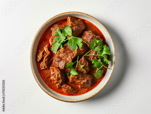 A plate of delicious beef curry isolated on white background.  