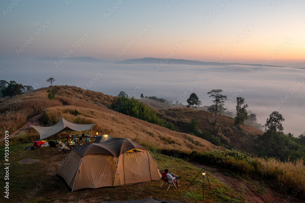 Camping tent with beautiful misty nature view