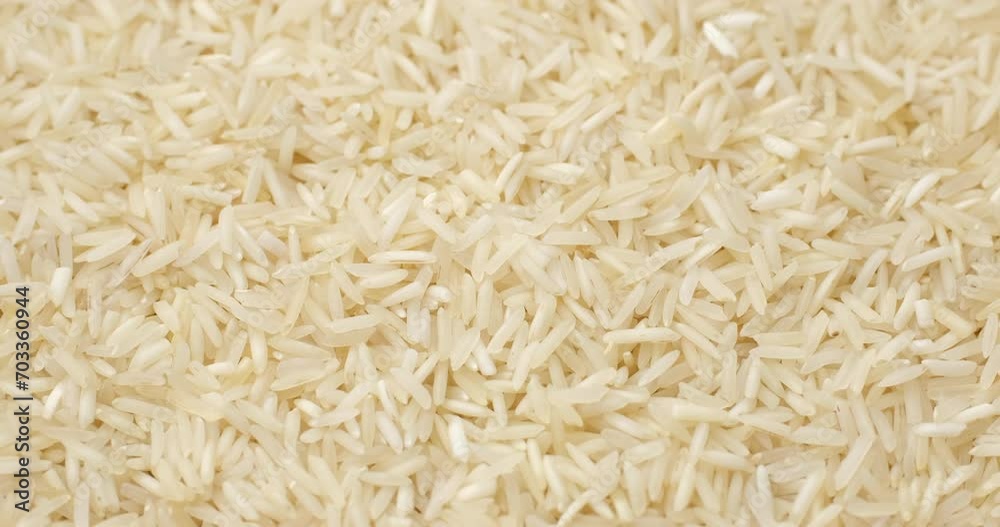 Heap of raw rice basmati, rotation. Asian Chinese Thai Japanese Indian traditional food Heap of raw rice basmati, rotation. Asian Chinese Thai Japanese Indian traditional food