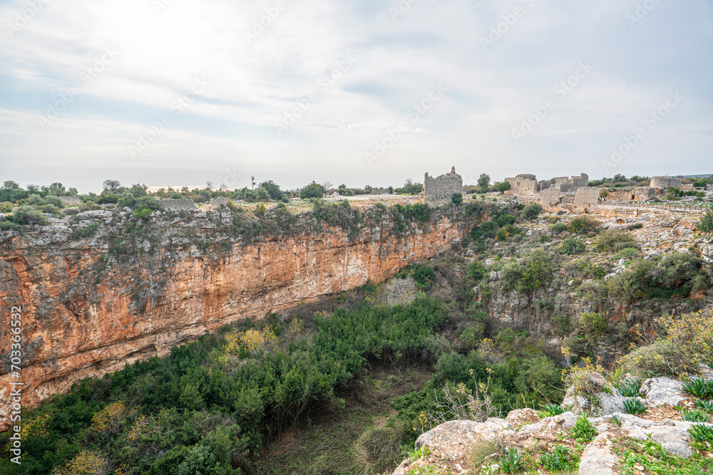 Amazing views from Kanlıdivane (ancient Canytelis), which is an ancient city situated around a big sinkhole in Mersin, Turkey.